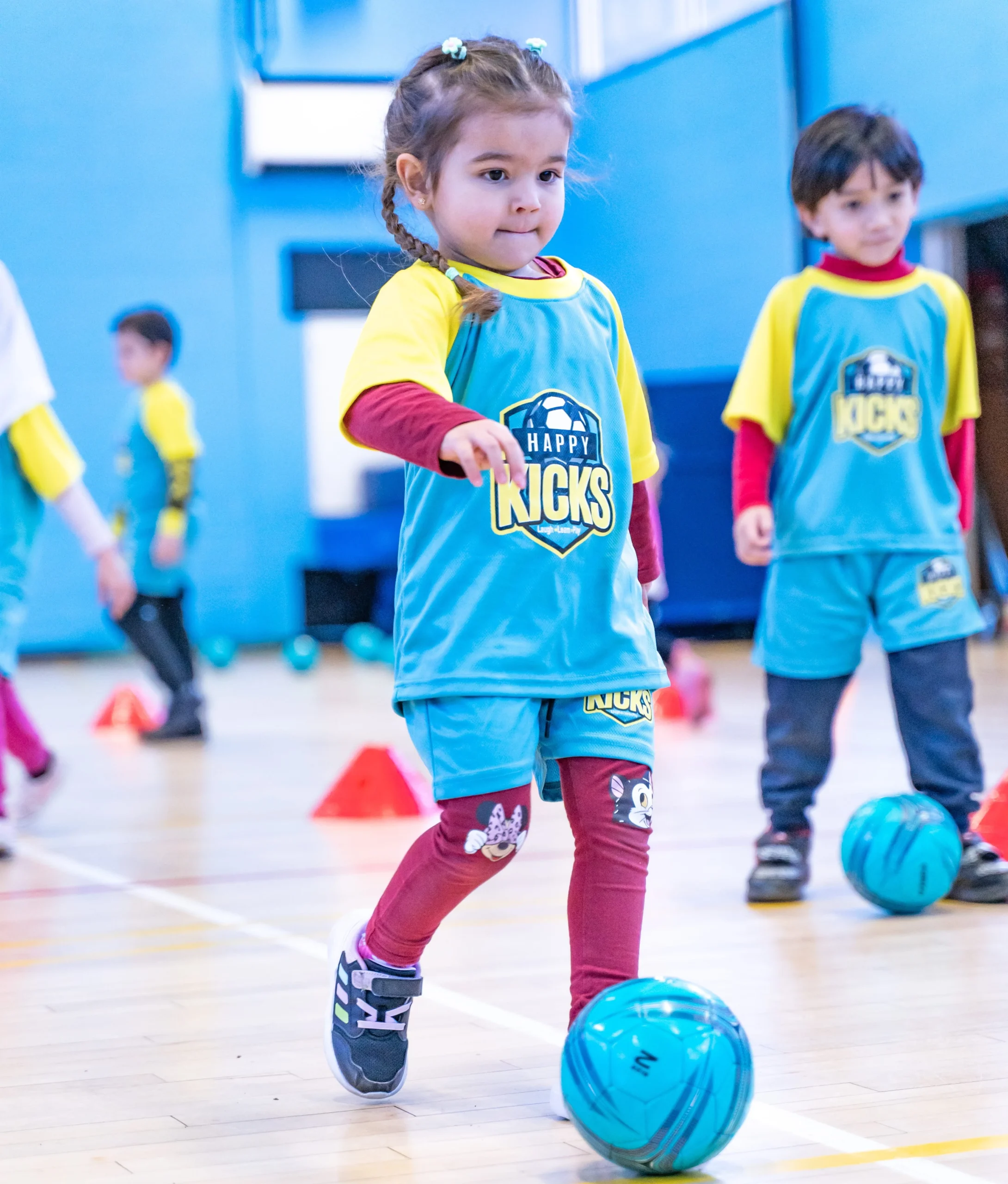 Children enjoying football training at an academy